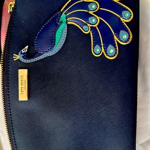 Peacock features Kate Spade New Your purse.Good condition reasonable price.